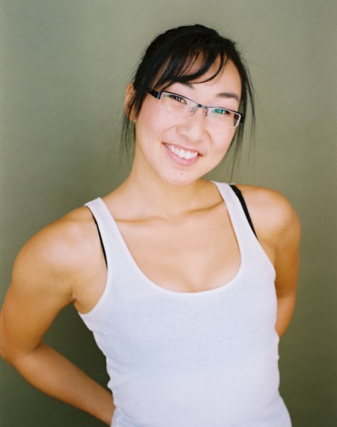 Andrea James Lui smiling headshot by Ian Brown