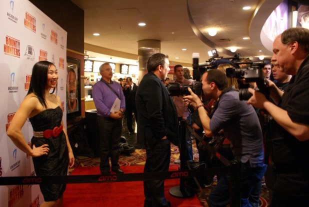 Andrea James Lui posing on the red carpet for Bounty Hunters