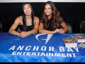 Andrea James Lui & Trish Stratus signing autographs at the Bounty Hunters premiere